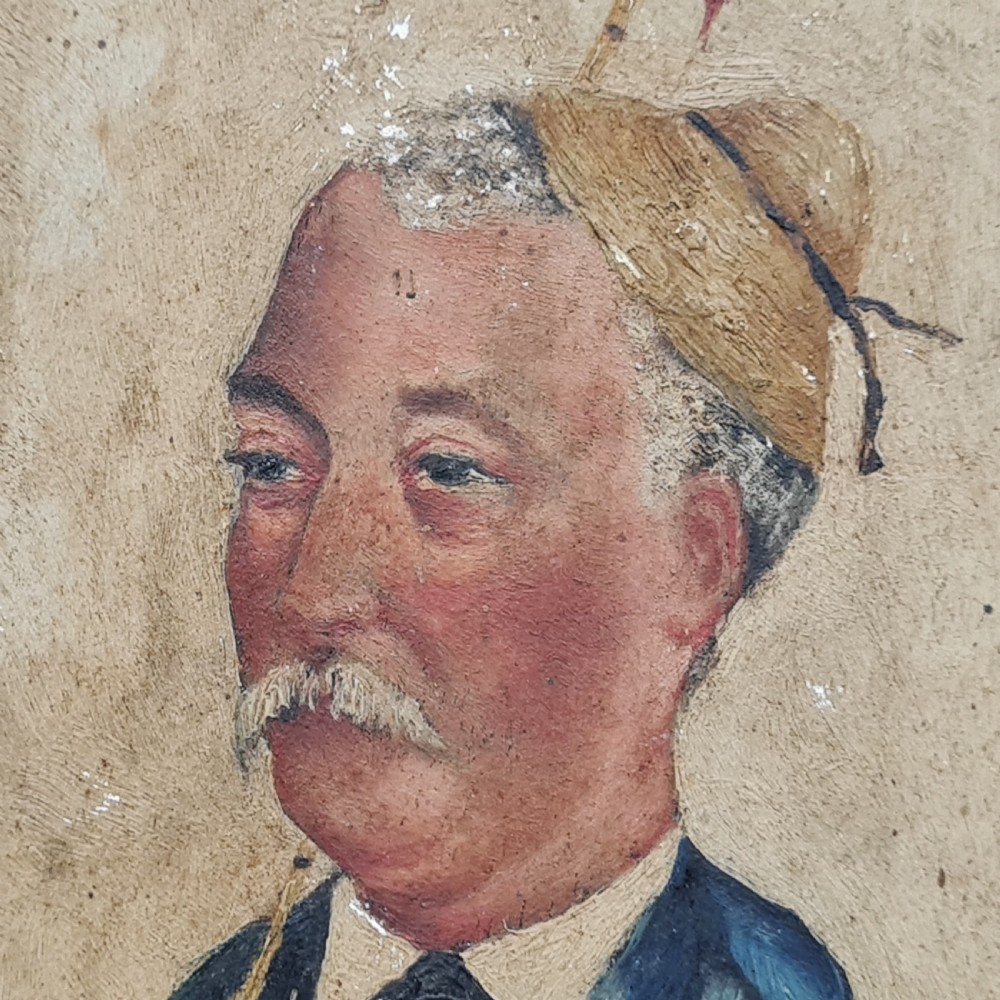 An antique oil painting on a rectangular wood panel depicting a caricatured fisherman with a moustache in a blue suit, holding a fishing rod and a basket containing fish. View III