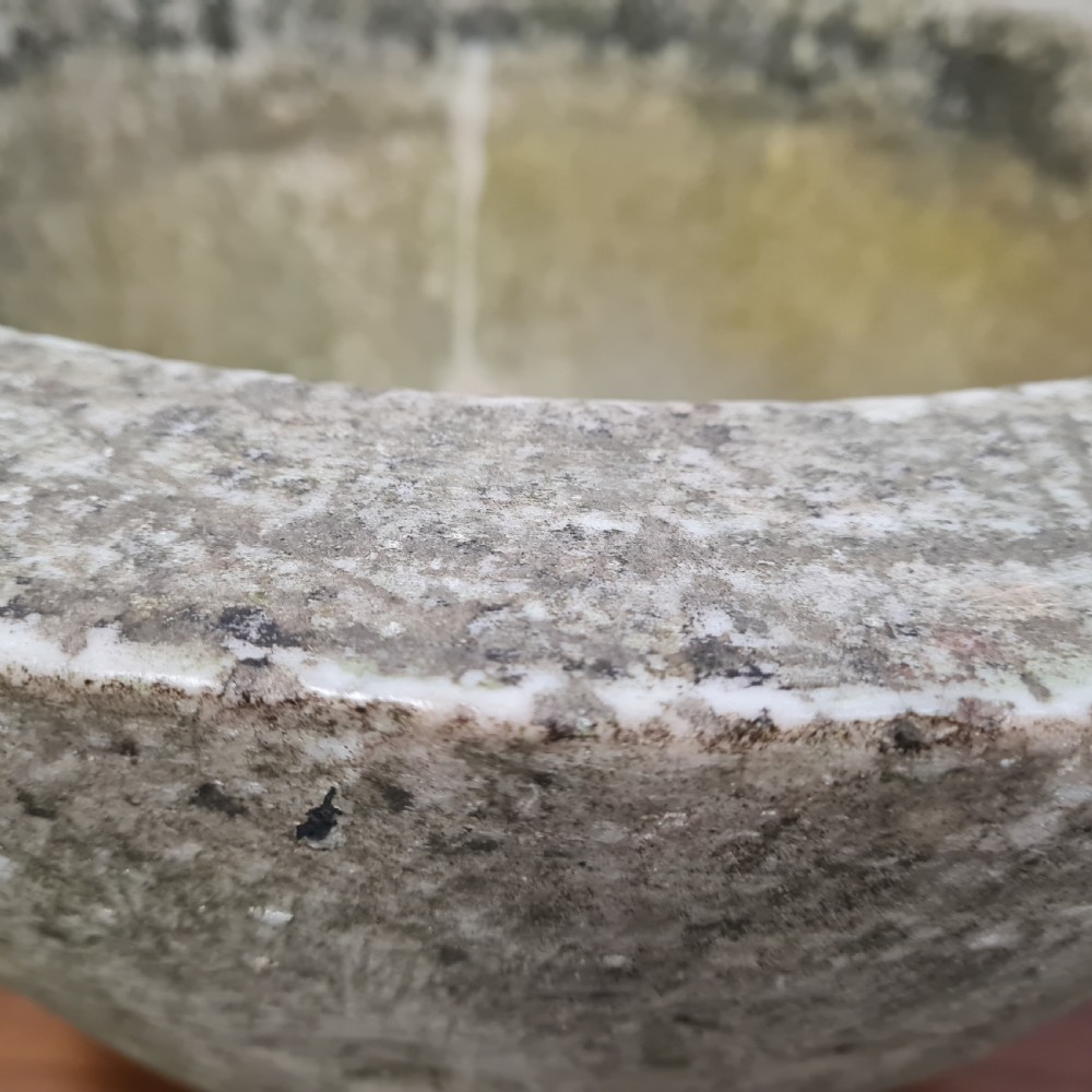 An 18th-century carved white marble mortar featuring four lug handles and a worn interior basin. View VI