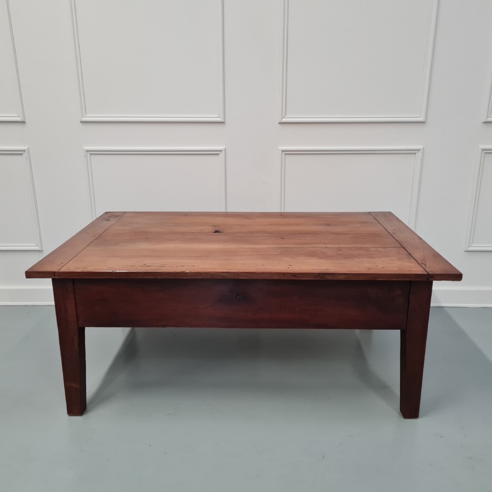 A mid-19th-century rectangular cherry wood coffee table featuring a single end drawer with a wooden knob and square tapered legs. View II