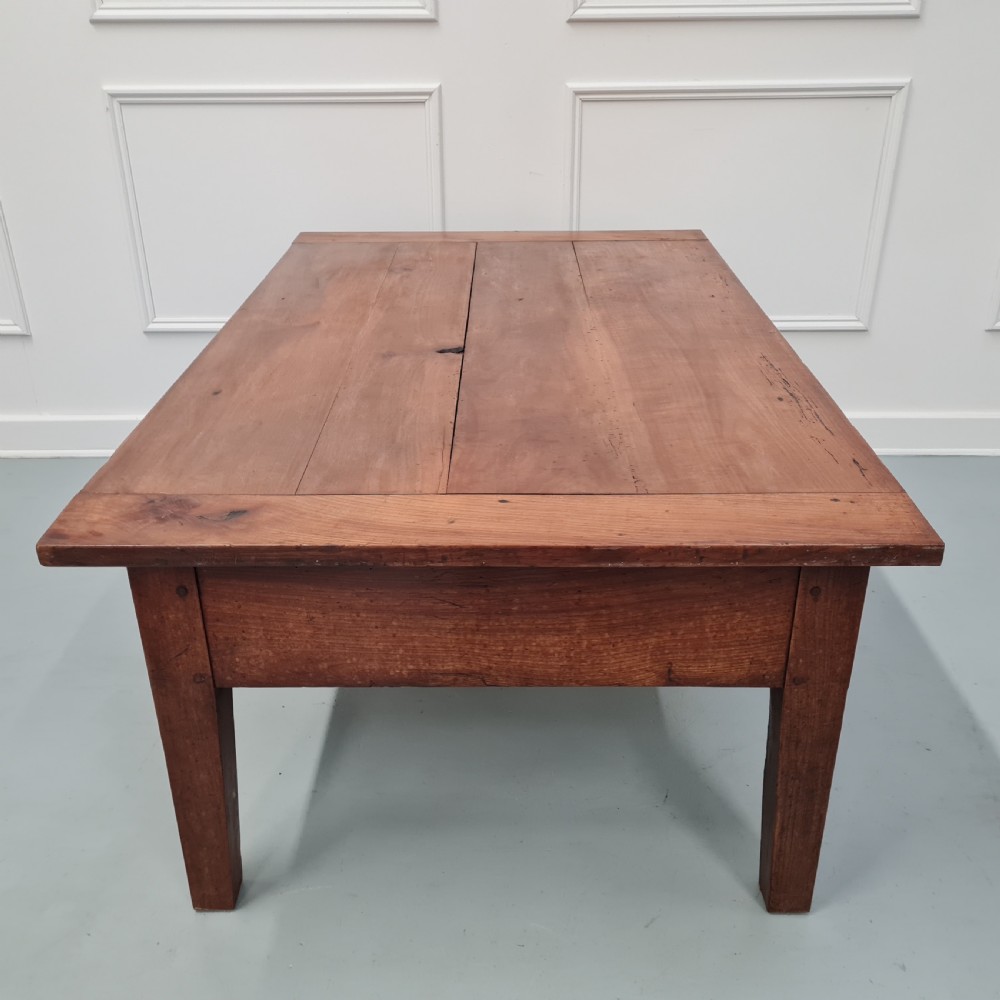 A mid-19th-century rectangular cherry wood coffee table featuring a single end drawer with a wooden knob and square tapered legs. View III