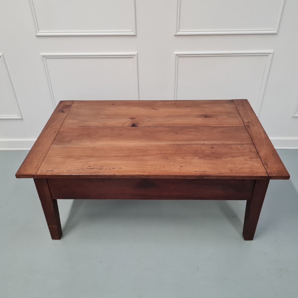 A mid-19th-century rectangular cherry wood coffee table featuring a single end drawer with a wooden knob and square tapered legs. View IV