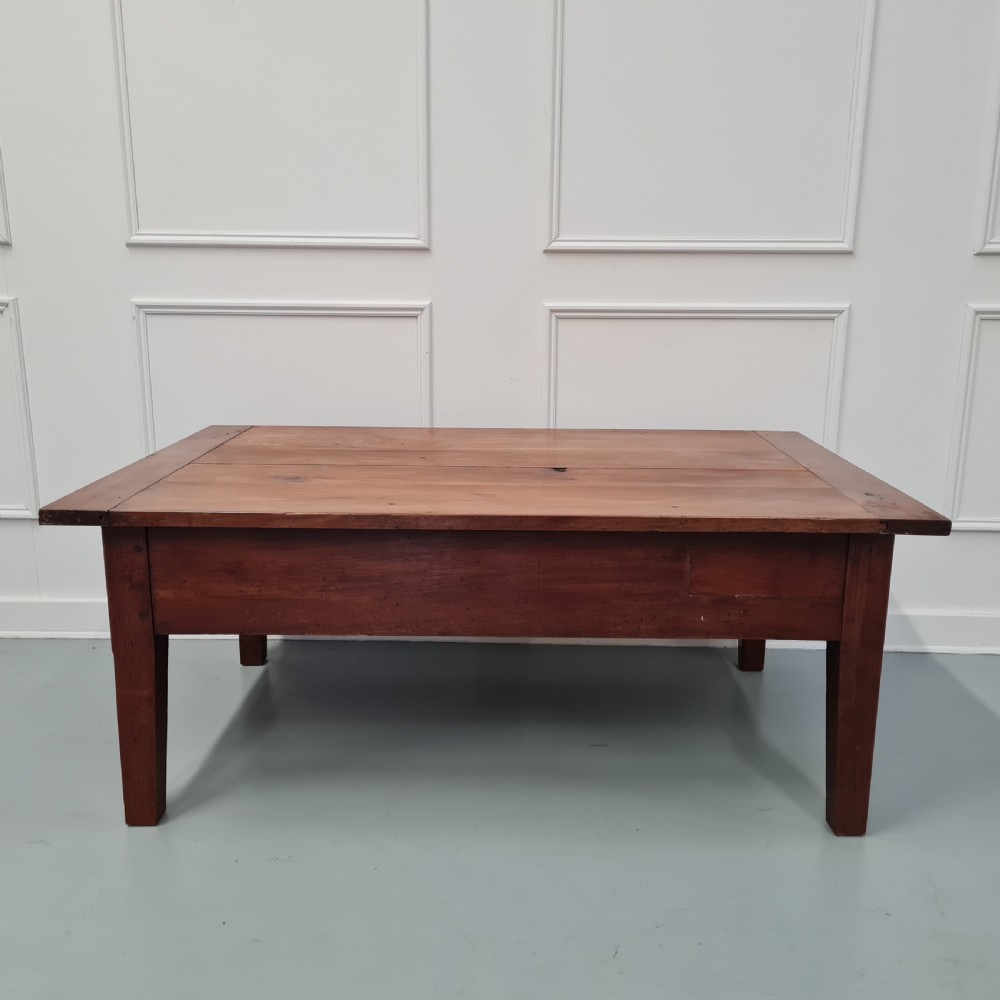 A mid-19th-century rectangular cherry wood coffee table featuring a single end drawer with a wooden knob and square tapered legs. View V