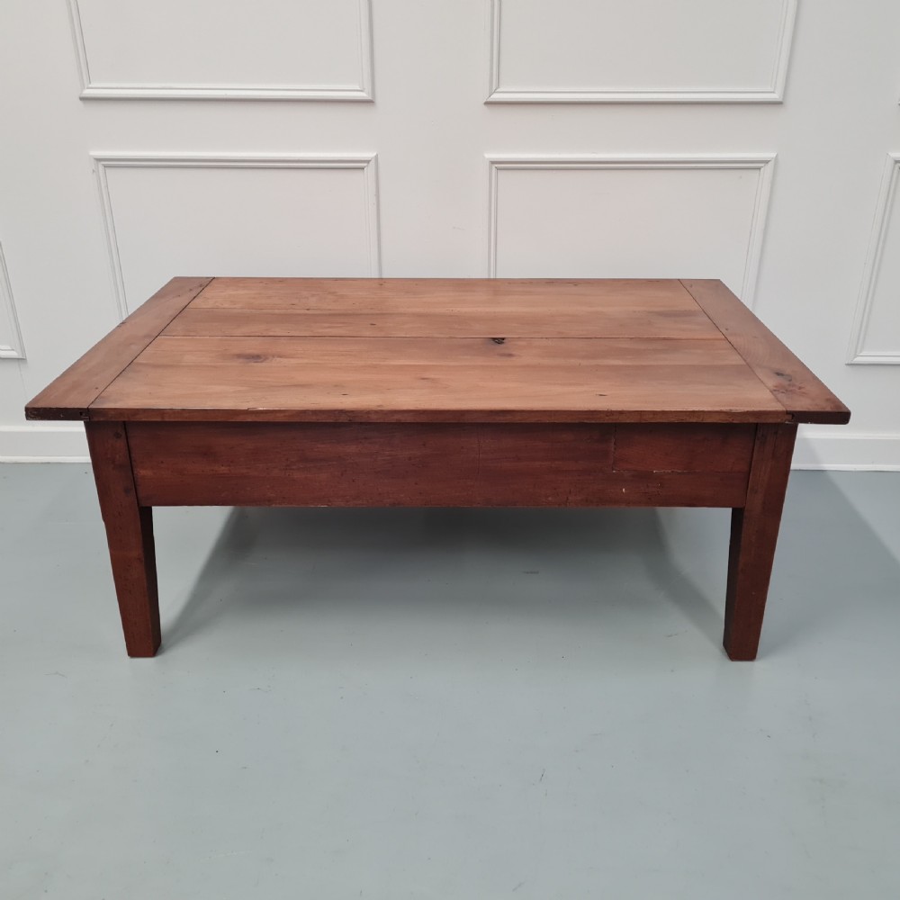 A mid-19th-century rectangular cherry wood coffee table featuring a single end drawer with a wooden knob and square tapered legs. View VI