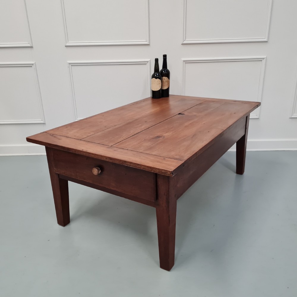 A mid-19th-century rectangular cherry wood coffee table featuring a single end drawer with a wooden knob and square tapered legs. View VII