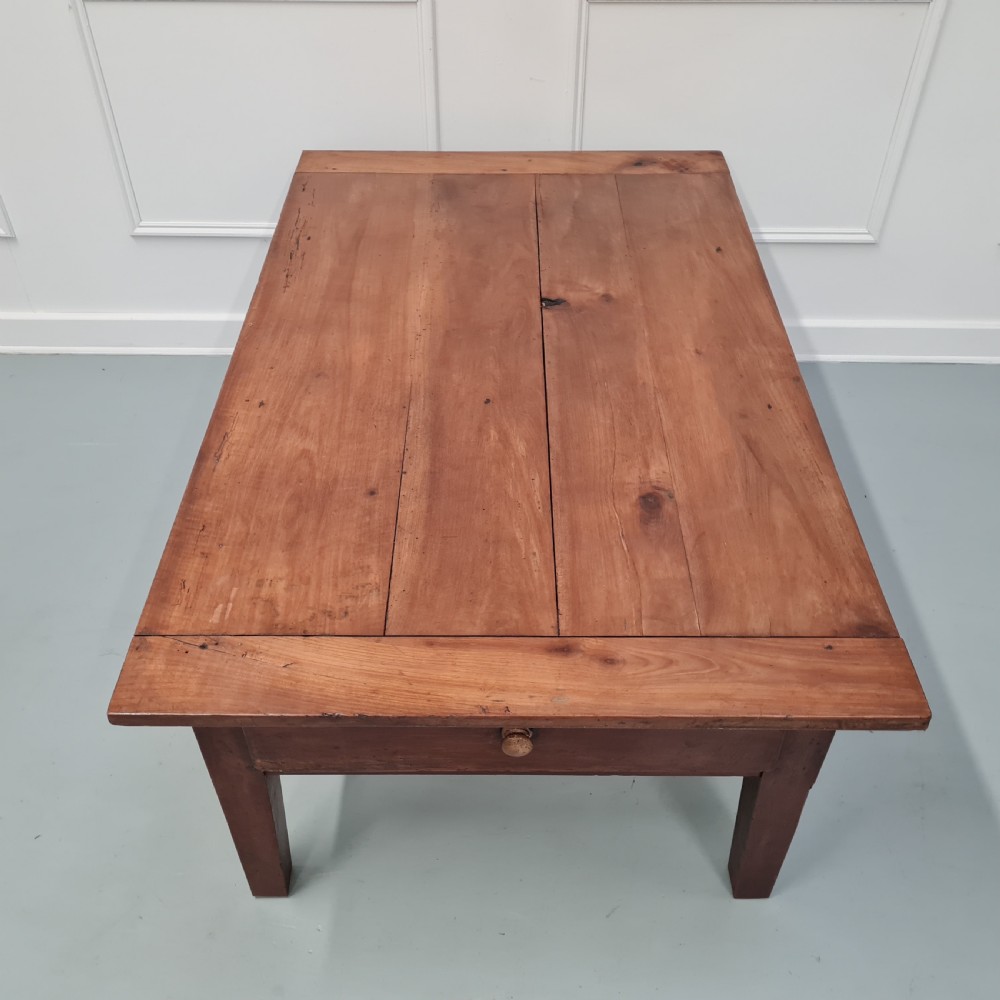 A mid-19th-century rectangular cherry wood coffee table featuring a single end drawer with a wooden knob and square tapered legs. View VIII