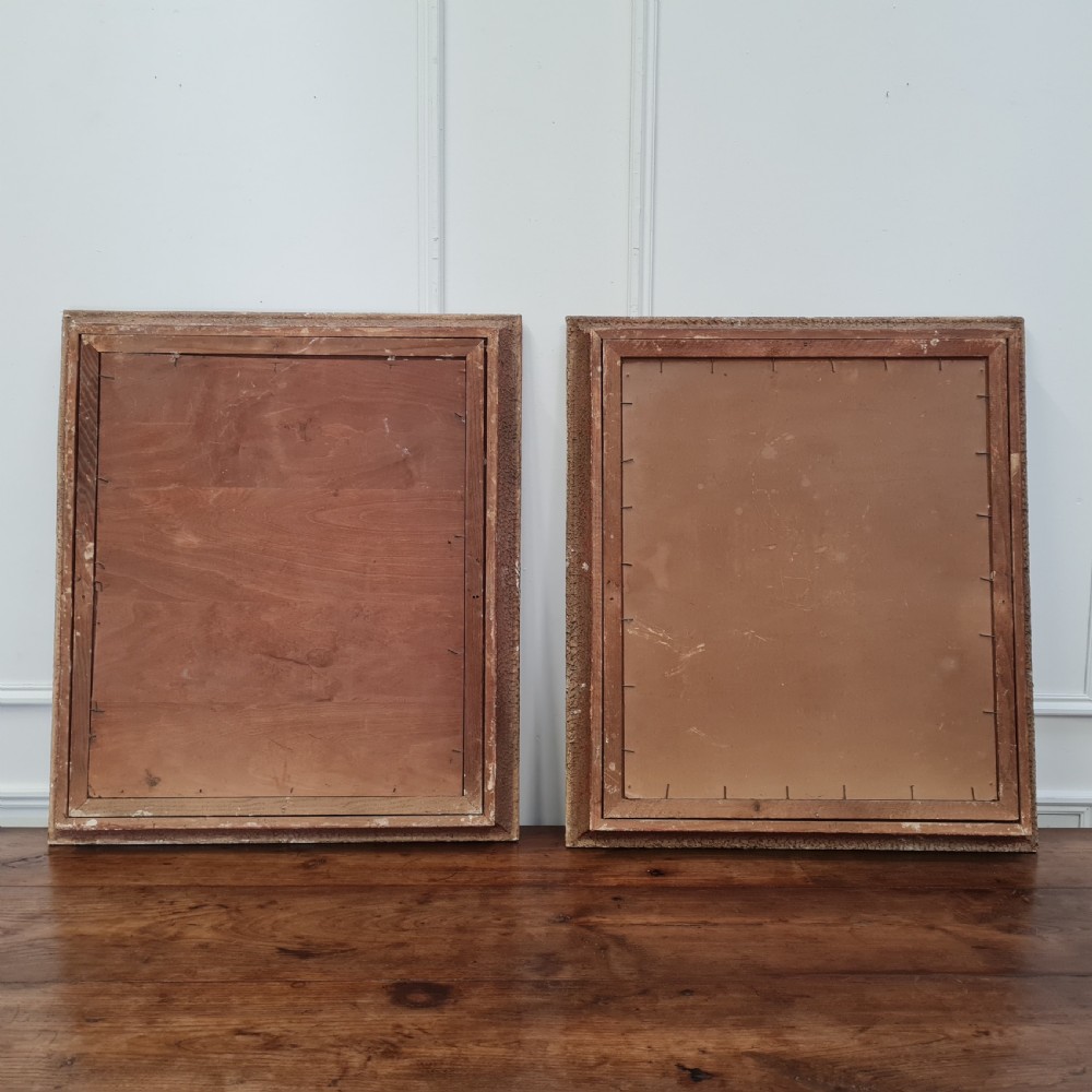 A pair of framed 1930s oil paintings depicting floral arrangements and fruit still life compositions in cream painted wooden frames. View II