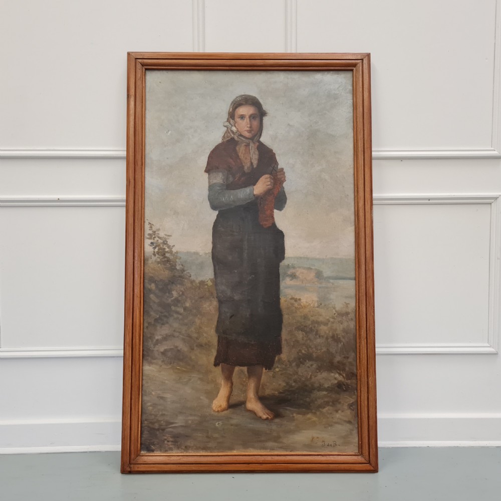 A full-length antique French oil portrait depicting a barefoot woman in traditional headscarf and apron standing in a landscape, presented in a moulded timber frame.