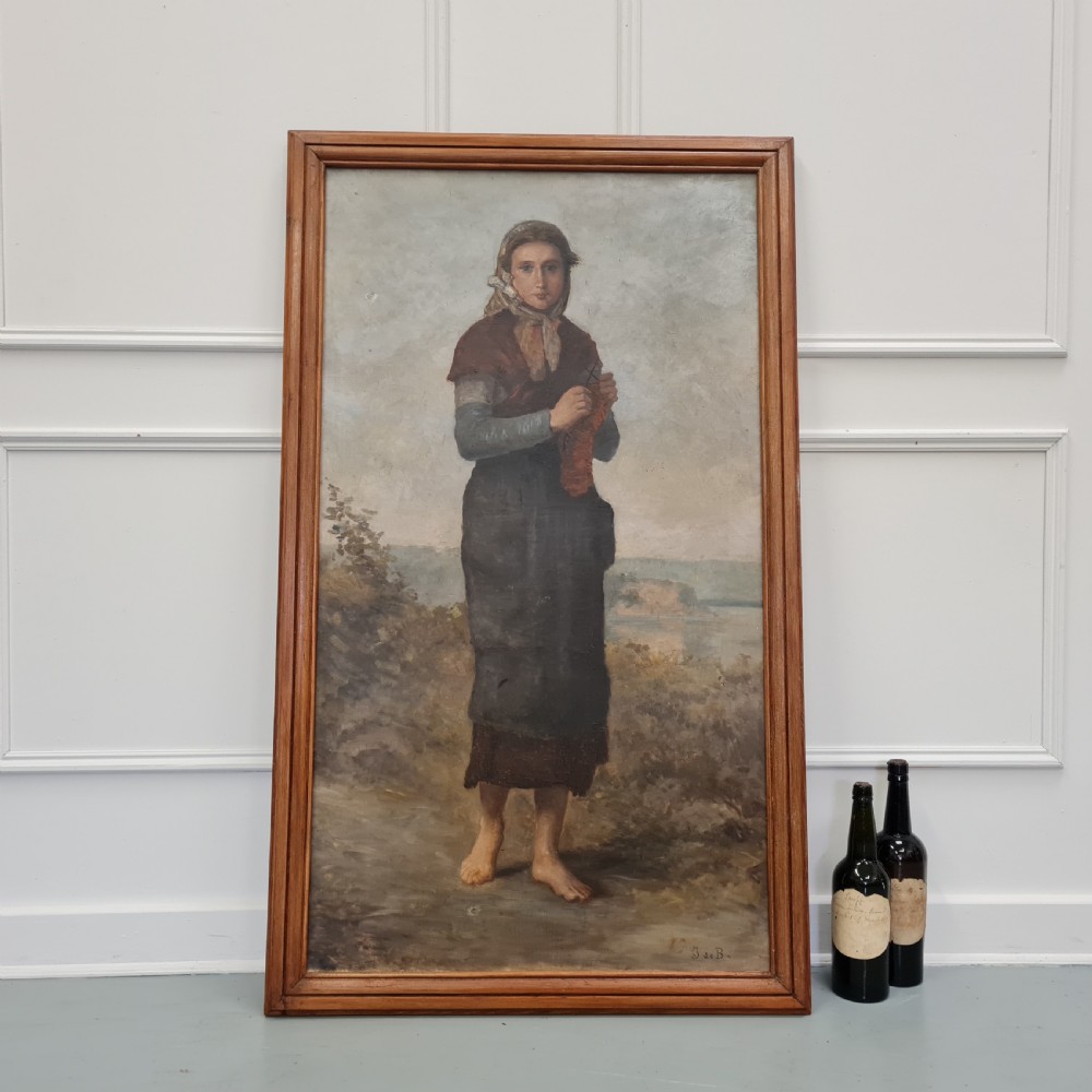 A full-length antique French oil portrait depicting a barefoot woman in traditional headscarf and apron standing in a landscape, presented in a moulded timber frame. View V