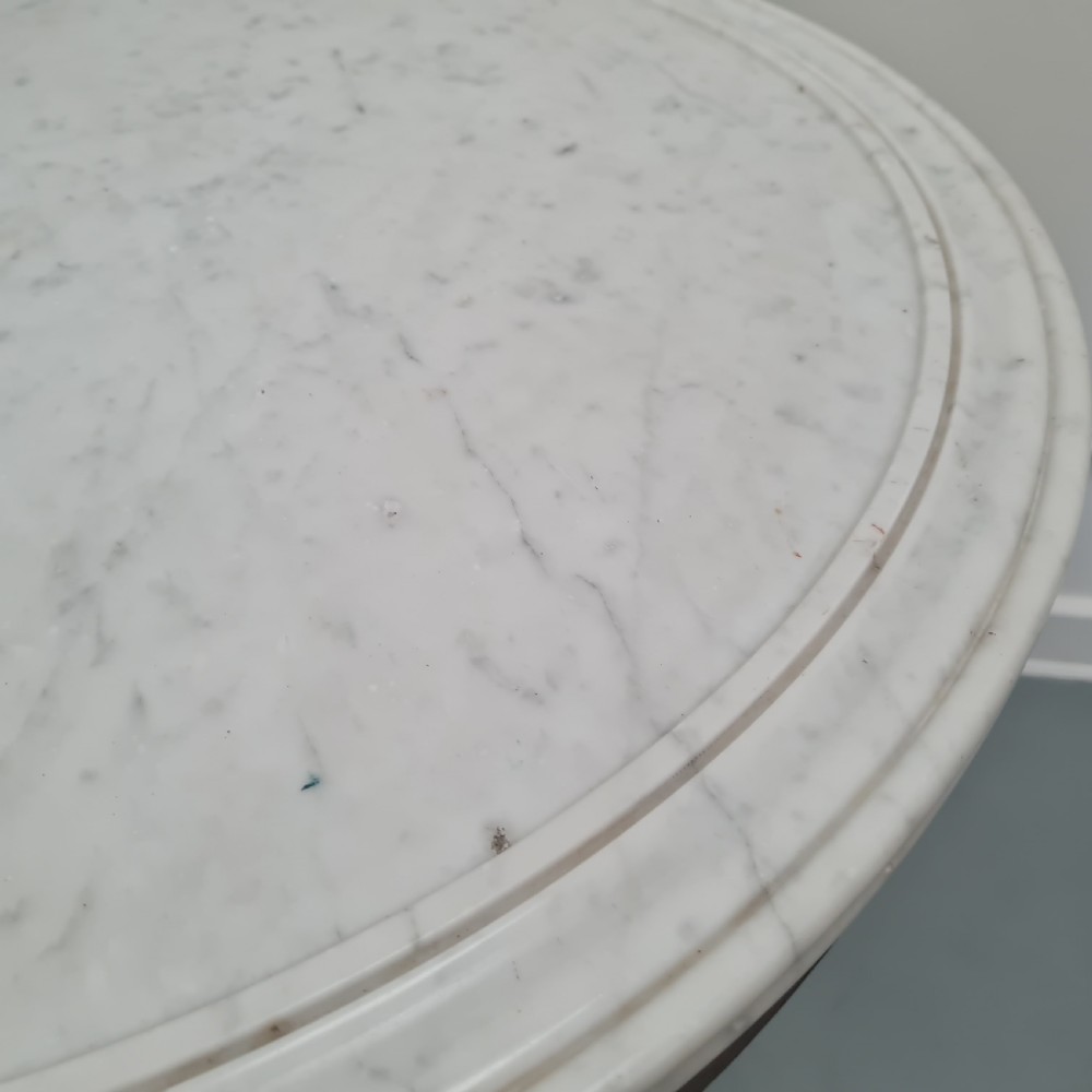 A 19th-century French gueridon table featuring a circular white marble top supported by a carved dark mahogany pedestal and scrolled tripod base. View II