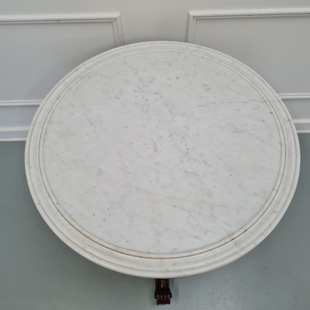 A 19th-century French gueridon table featuring a circular white marble top supported by a carved dark mahogany pedestal and scrolled tripod base. View III