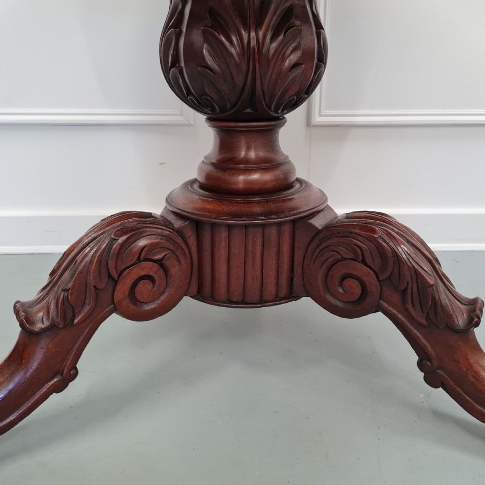 A 19th-century French gueridon table featuring a circular white marble top supported by a carved dark mahogany pedestal and scrolled tripod base. View IV