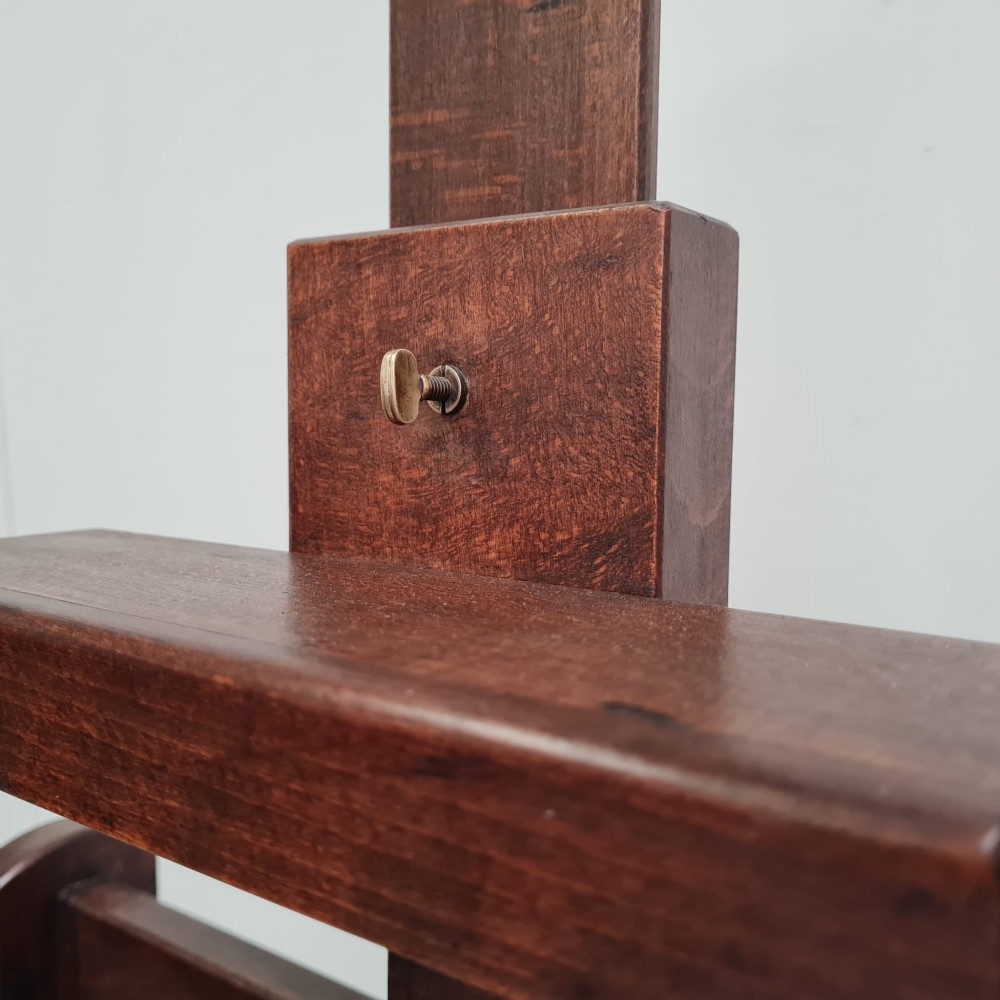 A dark brown French oak H-frame studio easel featuring an adjustable canvas shelf and metal side fixtures. View II