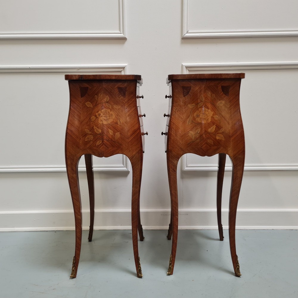 Pair of slender French Kingwood bedside tables with floral marquetry drawers and cabriole legs featuring brass sabots. View IV