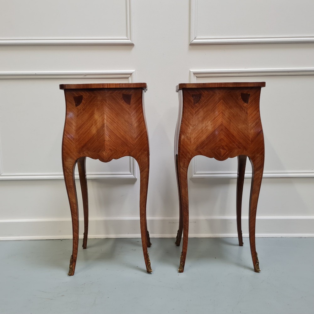 Pair of slender French Kingwood bedside tables with floral marquetry drawers and cabriole legs featuring brass sabots. View VI