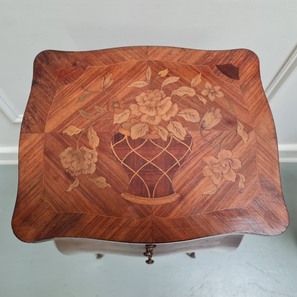 Pair of slender French Kingwood bedside tables with floral marquetry drawers and cabriole legs featuring brass sabots. View IX