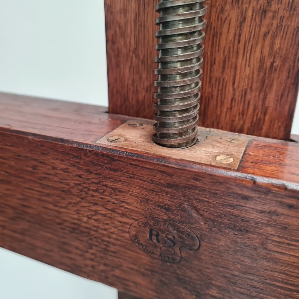 An antique dark oak studio winder easel featuring a mechanical hand crank handle and a floor base equipped with castors. View VI