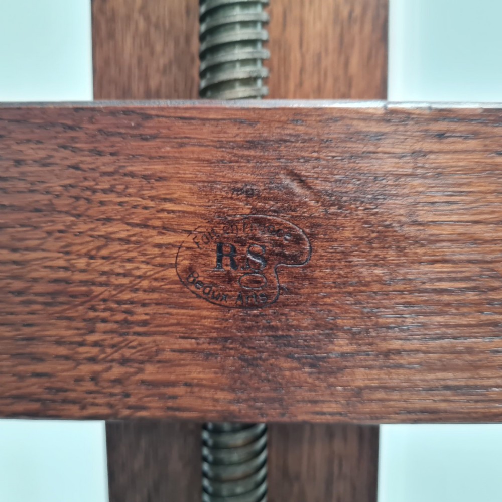 An antique dark oak studio winder easel featuring a mechanical hand crank handle and a floor base equipped with castors. View VIII