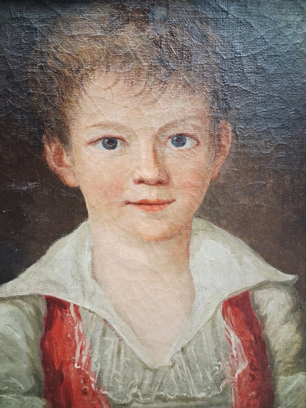 A pair of 19th-century oil portrait paintings depicting a young girl and boy set inside wide moulded giltwood frames. View VII