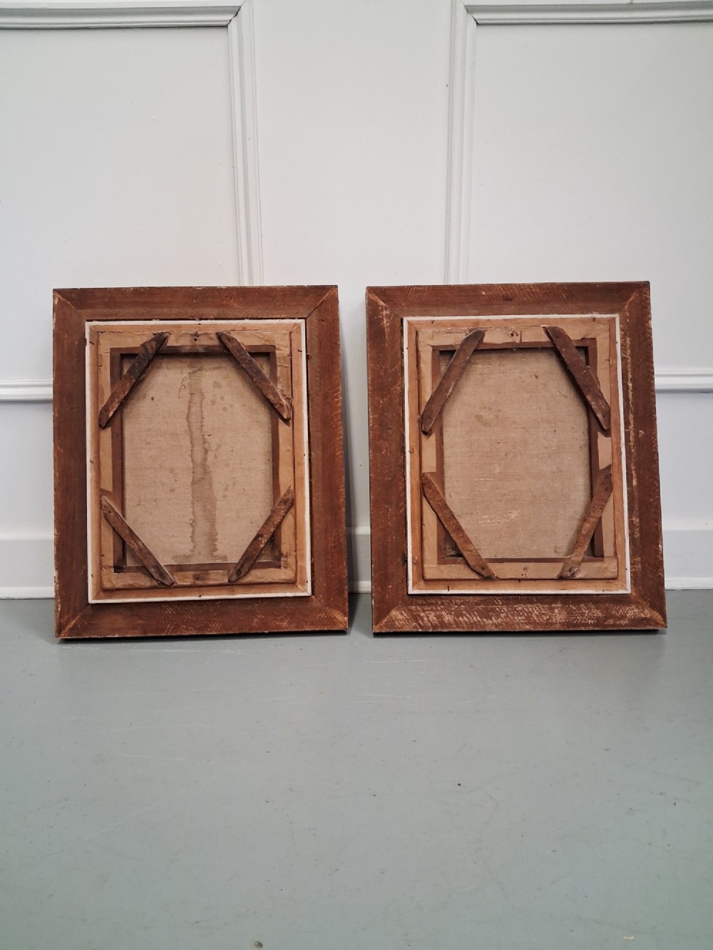 A pair of 19th-century oil portrait paintings depicting a young girl and boy set inside wide moulded giltwood frames. View IX