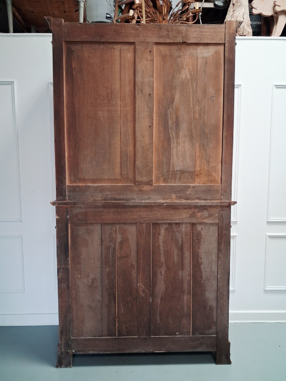 A tall mid-19th century two-tier French provincial housekeepers cupboard with painted ochre timber, panelled cupboard doors, and two central drawers. View VII