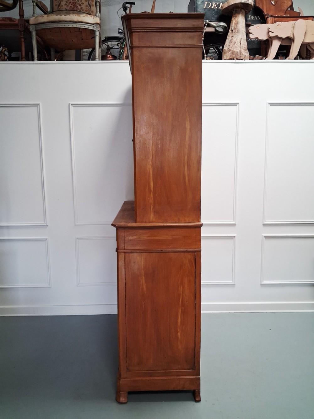 A tall mid-19th century two-tier French provincial housekeepers cupboard with painted ochre timber, panelled cupboard doors, and two central drawers. View VIII
