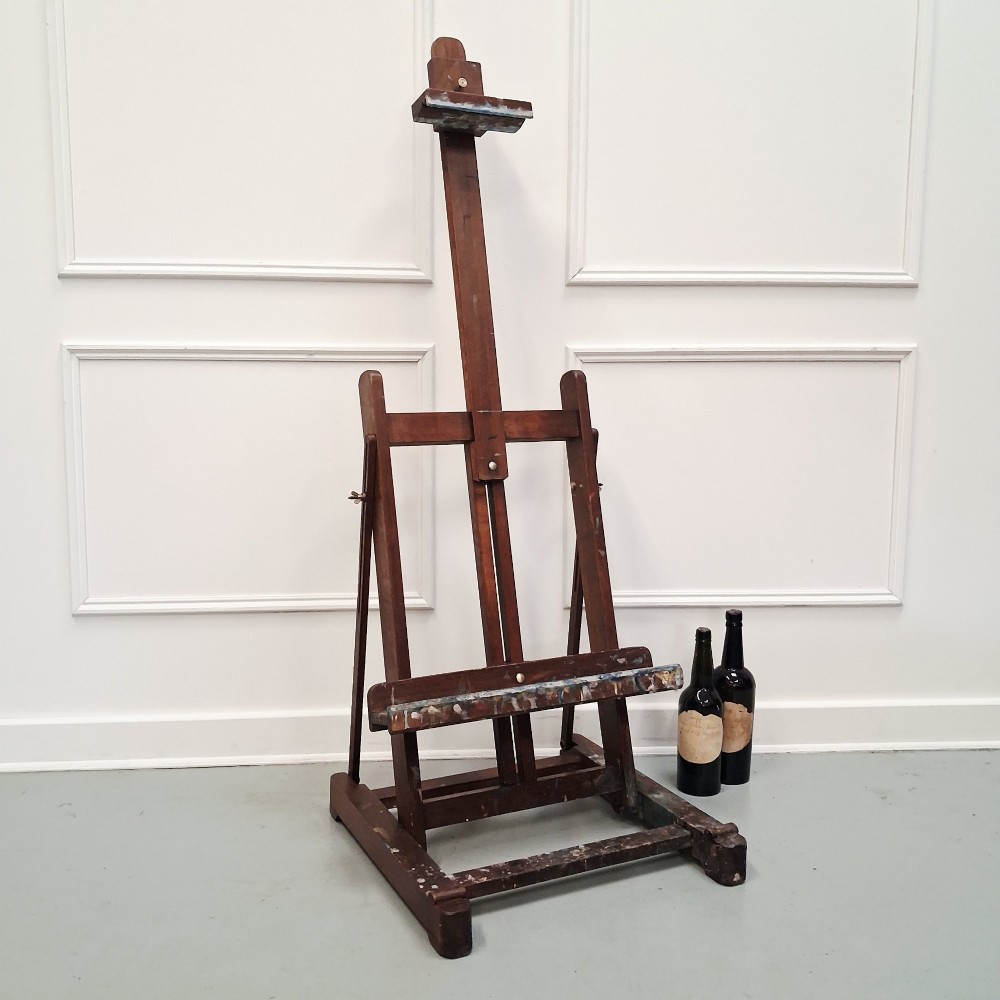 A dark oak French tabletop easel from circa 1930 featuring paint splatter details along the adjustable support ledge and central vertical frame. View XI