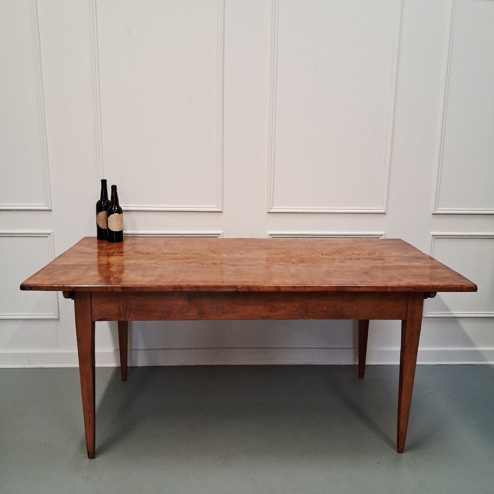 An antique 19th-century satin birch farmhouse table featuring a rectangular plank top, deep apron, and four square tapered legs. View II