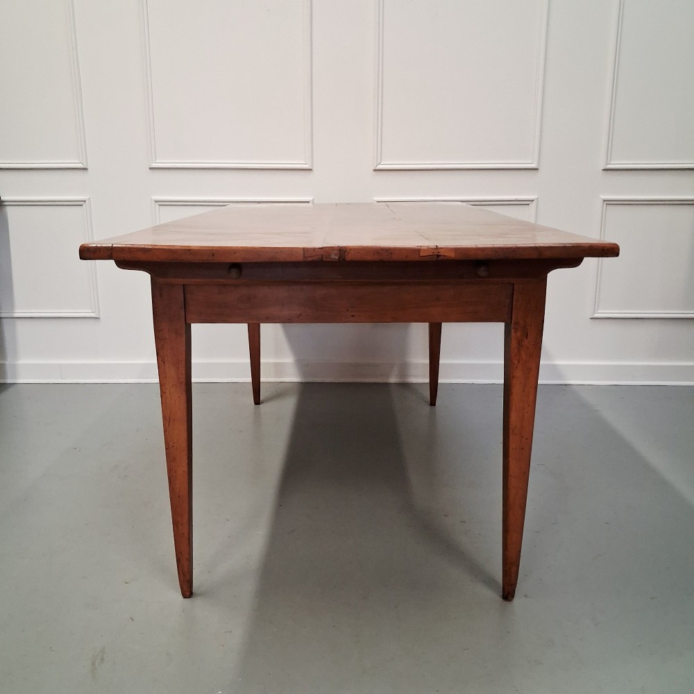 An antique 19th-century satin birch farmhouse table featuring a rectangular plank top, deep apron, and four square tapered legs. View VIII