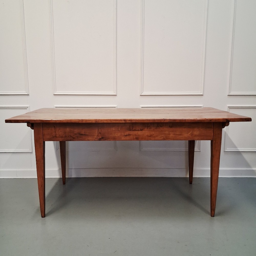 An antique 19th-century satin birch farmhouse table featuring a rectangular plank top, deep apron, and four square tapered legs. View IX