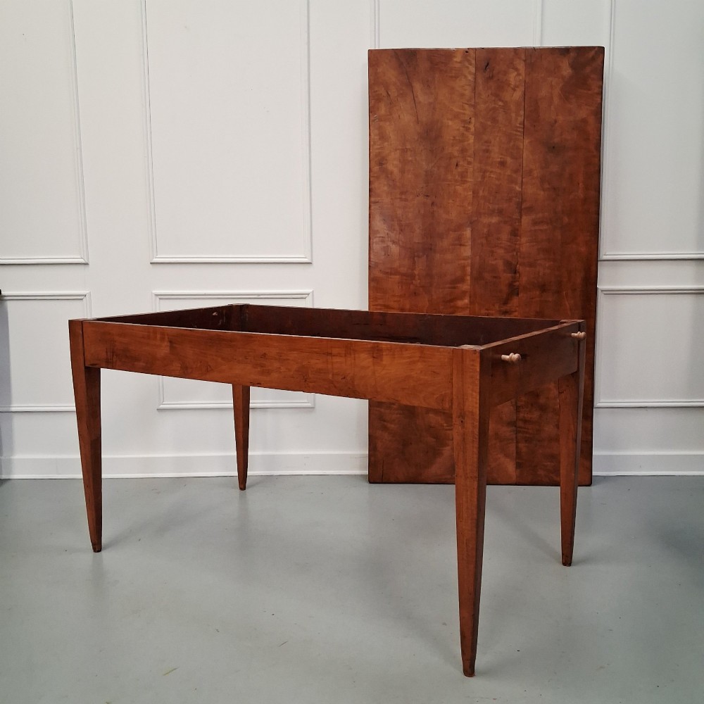 An antique 19th-century satin birch farmhouse table featuring a rectangular plank top, deep apron, and four square tapered legs. View XIII