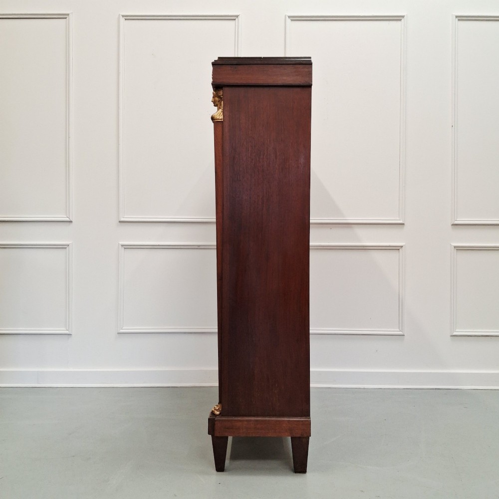 Large French mahogany open bookcase featuring four horizontal shelves flanked by side columns topped with gilded caryatid mounts. View IV