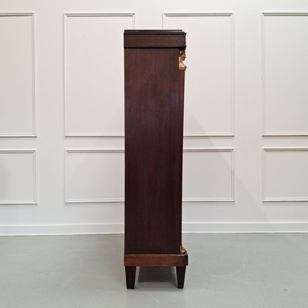 Large French mahogany open bookcase featuring four horizontal shelves flanked by side columns topped with gilded caryatid mounts. View VI