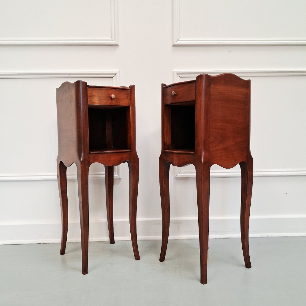 A pair of tall French cherry wood bedside tables with single drawers, open storage niches, and slender cabriole legs. View III