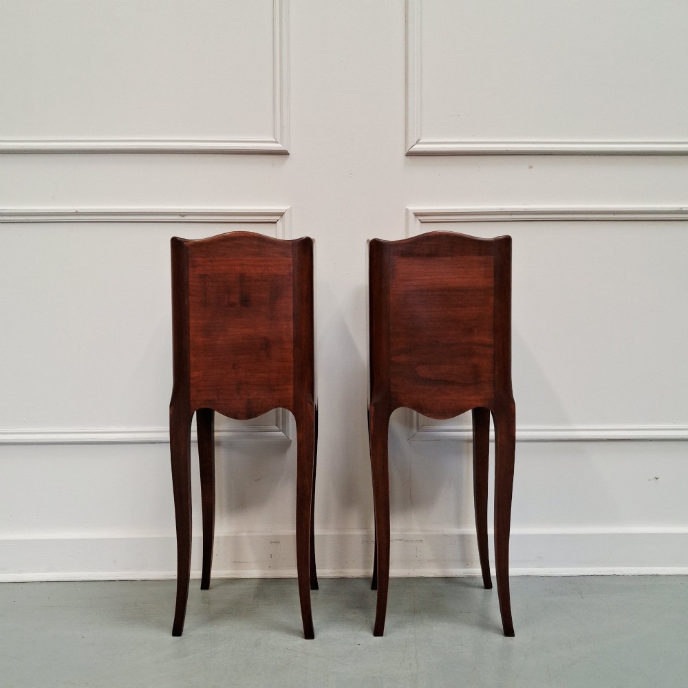 A pair of tall French cherry wood bedside tables with single drawers, open storage niches, and slender cabriole legs. View VI