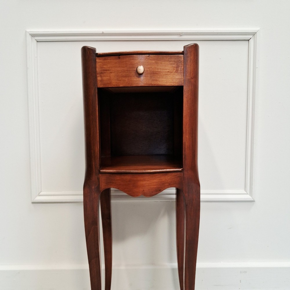 A pair of tall French cherry wood bedside tables with single drawers, open storage niches, and slender cabriole legs. View VIII
