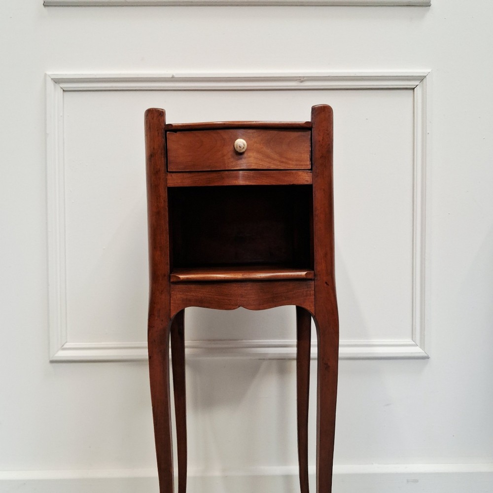 A pair of tall French cherry wood bedside tables featuring single frieze drawers, open compartments, and slender cabriole legs. View VIII