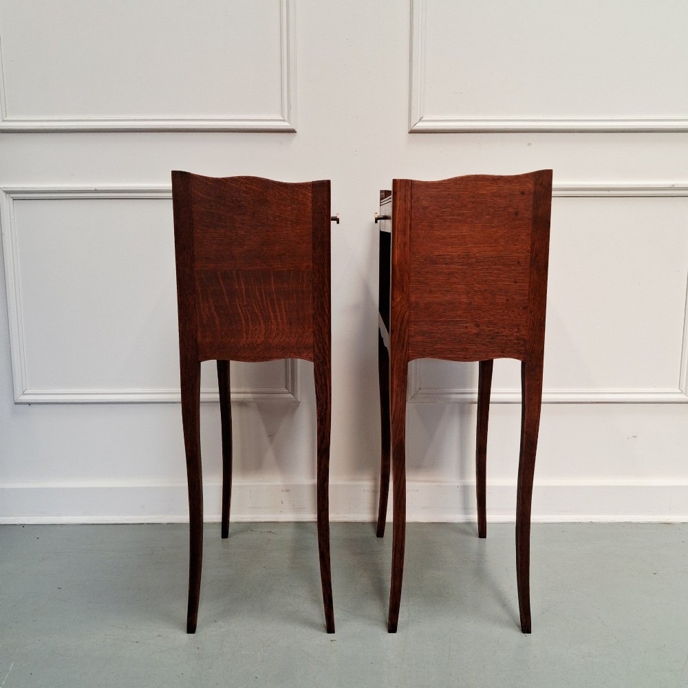 A pair of tall French oak bedside tables featuring single top drawers, open storage alcoves, scalloped aprons, and slender curved cabriole legs. View II
