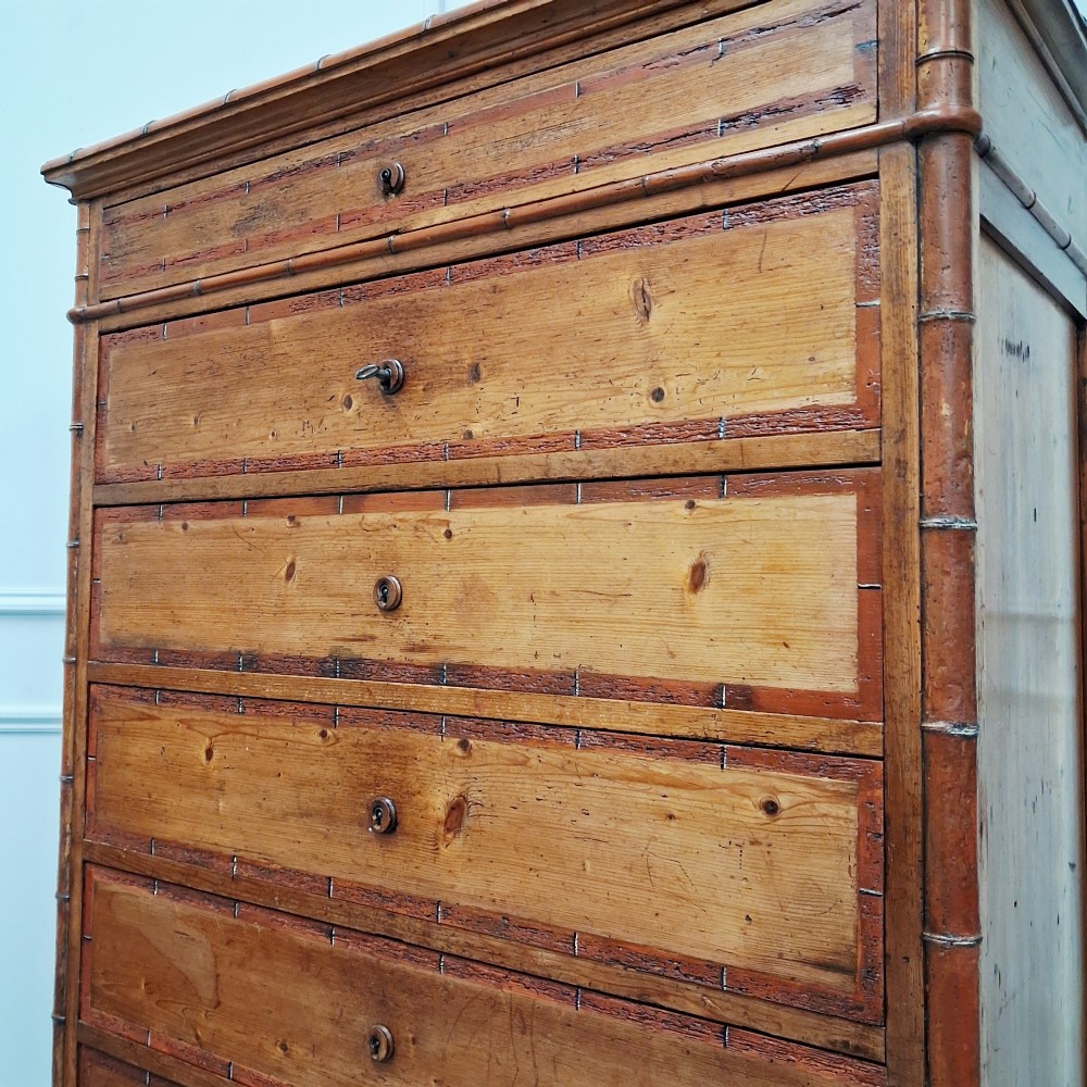 A tall 19th-century French wooden semainier chest featuring seven drawers framed by turned faux bamboo mouldings and supported by bun feet. View IX