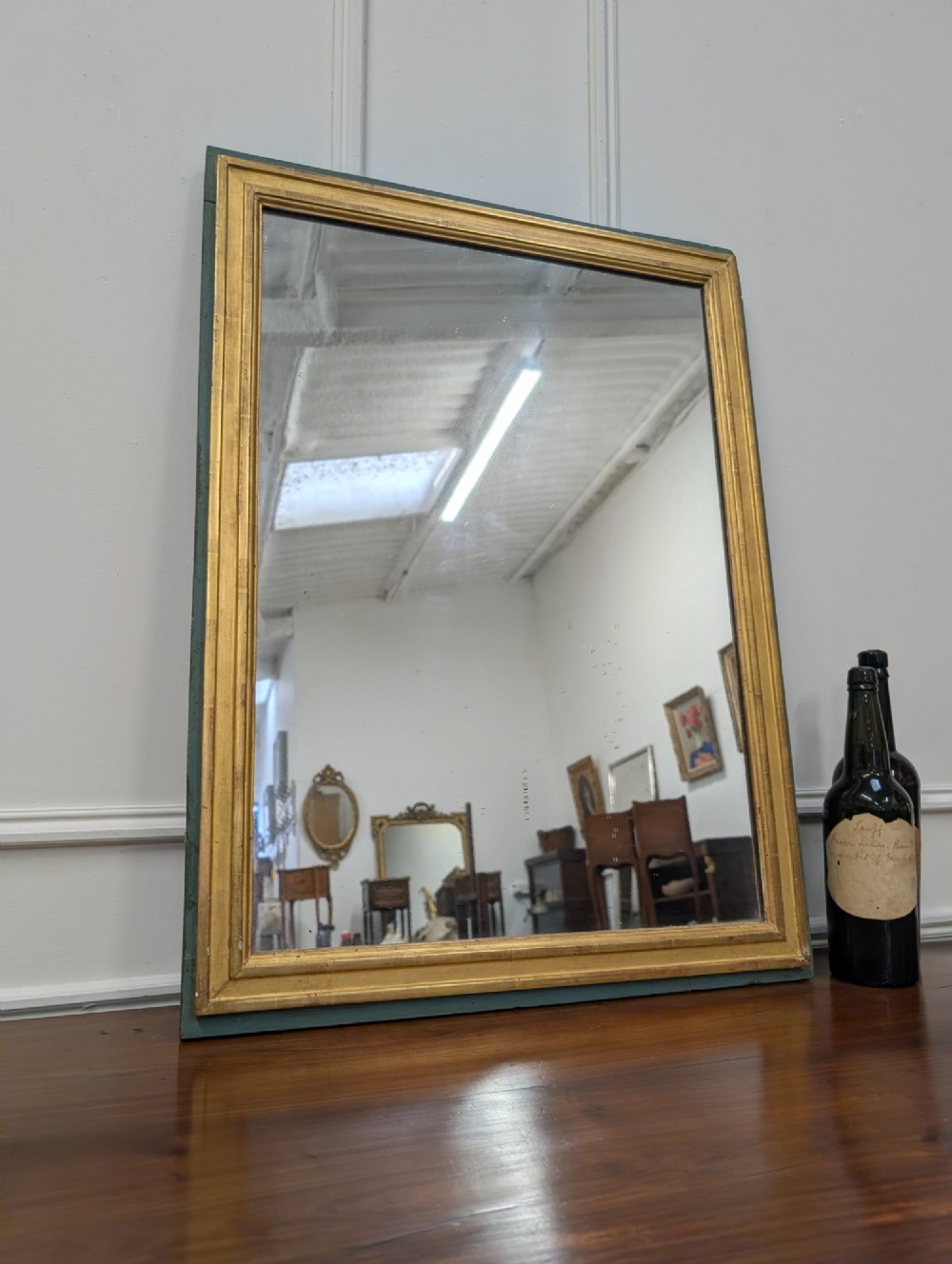 A rectangular 1920s French wall mirror with a gilded inner frame profile surrounded by a slate grey painted border. View III