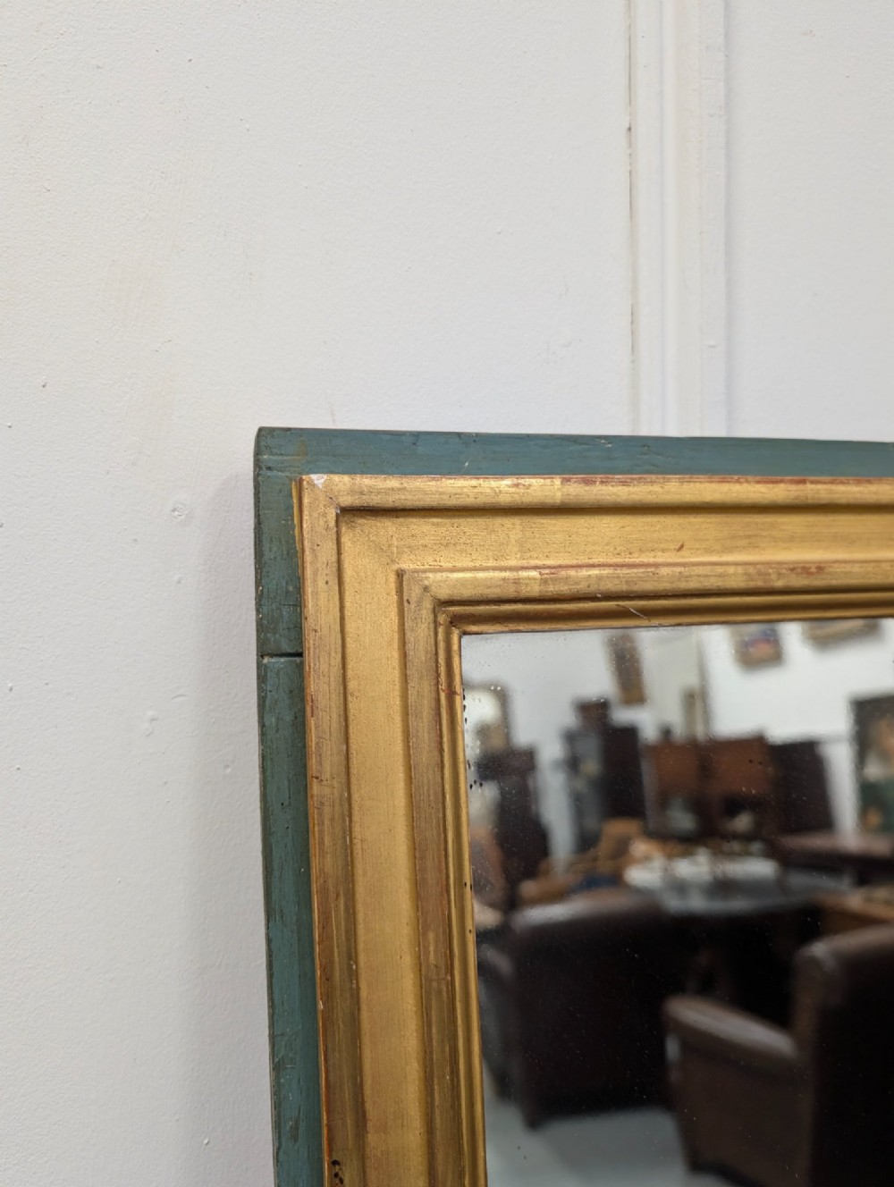 A rectangular 1920s French wall mirror with a gilded inner frame profile surrounded by a slate grey painted border. View IV