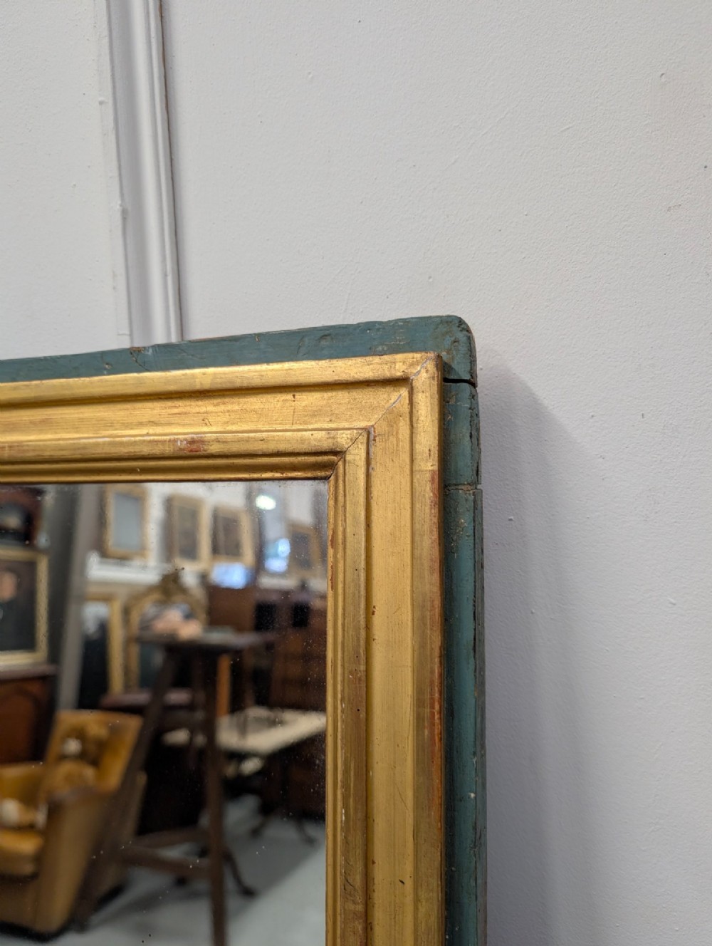 A rectangular 1920s French wall mirror with a gilded inner frame profile surrounded by a slate grey painted border. View V