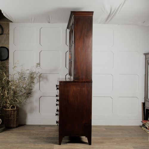 fig 3. A 19th-century mahogany secretaire bookcase featuring an upper glazed cabinet with gothic arch doors and a lower chest of drawers.