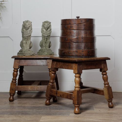 fig 1. A cylindrical early 19th-century dark oak grain bin with bound wooden hoops, metal rivets, and a fitted lid.
