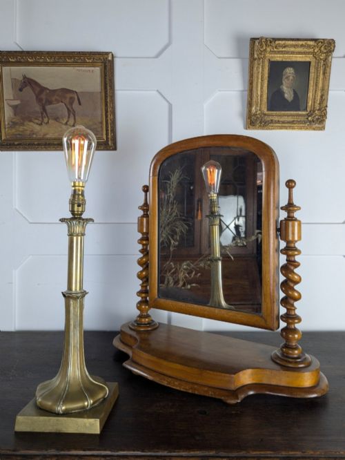 fig 2. A Victorian satinwood toilet mirror featuring twin barley twist uprights, a curved base, and an arched tilting frame with mercury glass.