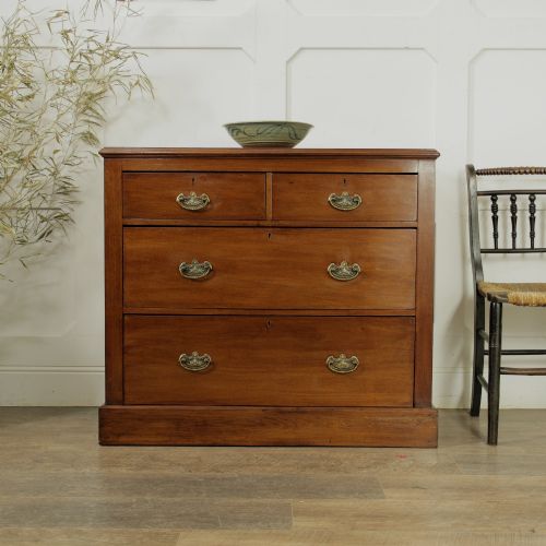 fig 1. A late Victorian mahogany chest of drawers featuring two short drawers over two long drawers with brass handles on a plinth base.