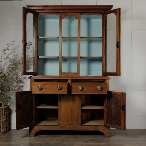 fig 2. A late Victorian stripped pitch pine glazed cupboard with a three-door glazed upper display section above two drawers and three lower panelled cabinet doors.