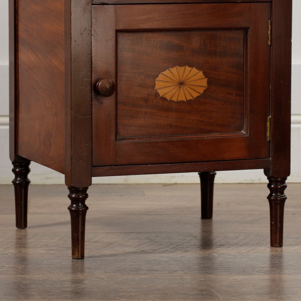A Victorian mahogany pot cupboard with an open upper shelf supported by turned columns, sitting above a single-door cupboard adorned with a central marquetry inlay. View XIII