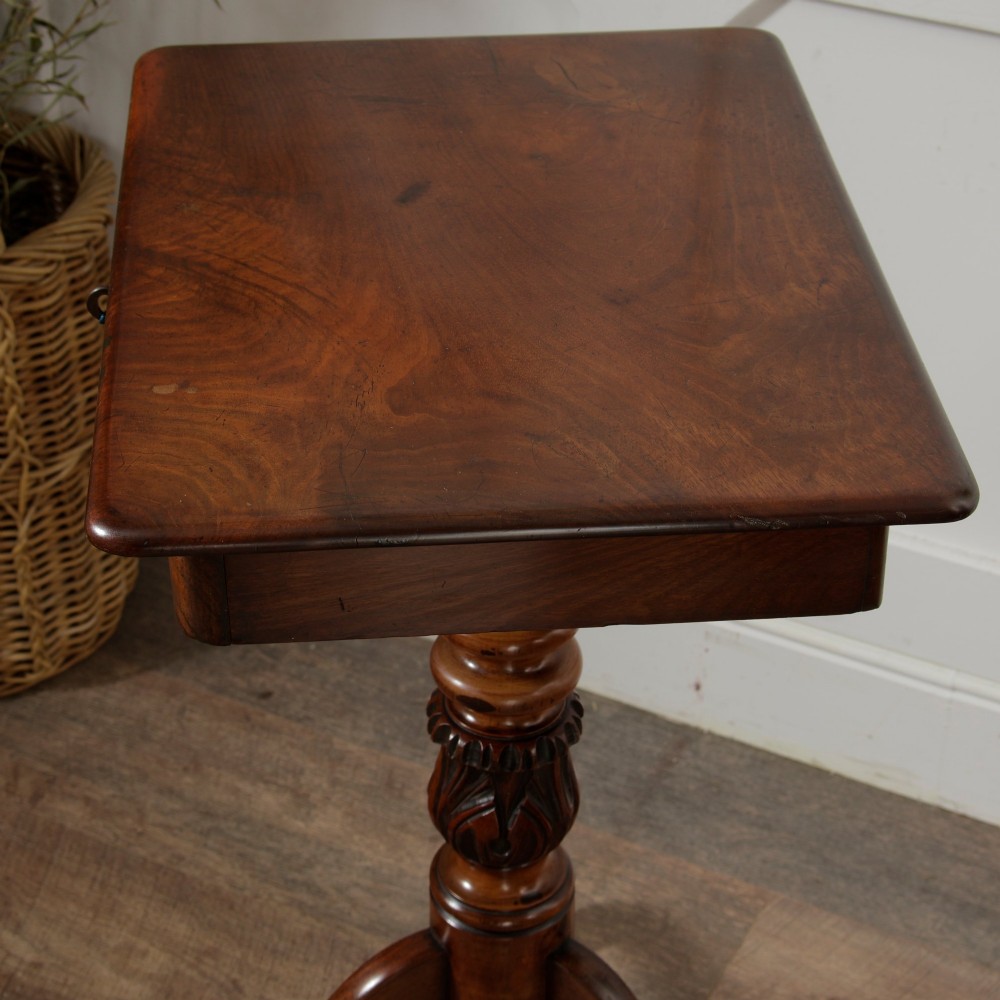 A Victorian mahogany pedestal table featuring a square top with a drawer, a central bobbin-turned stem, and a carved tripod base. View VI