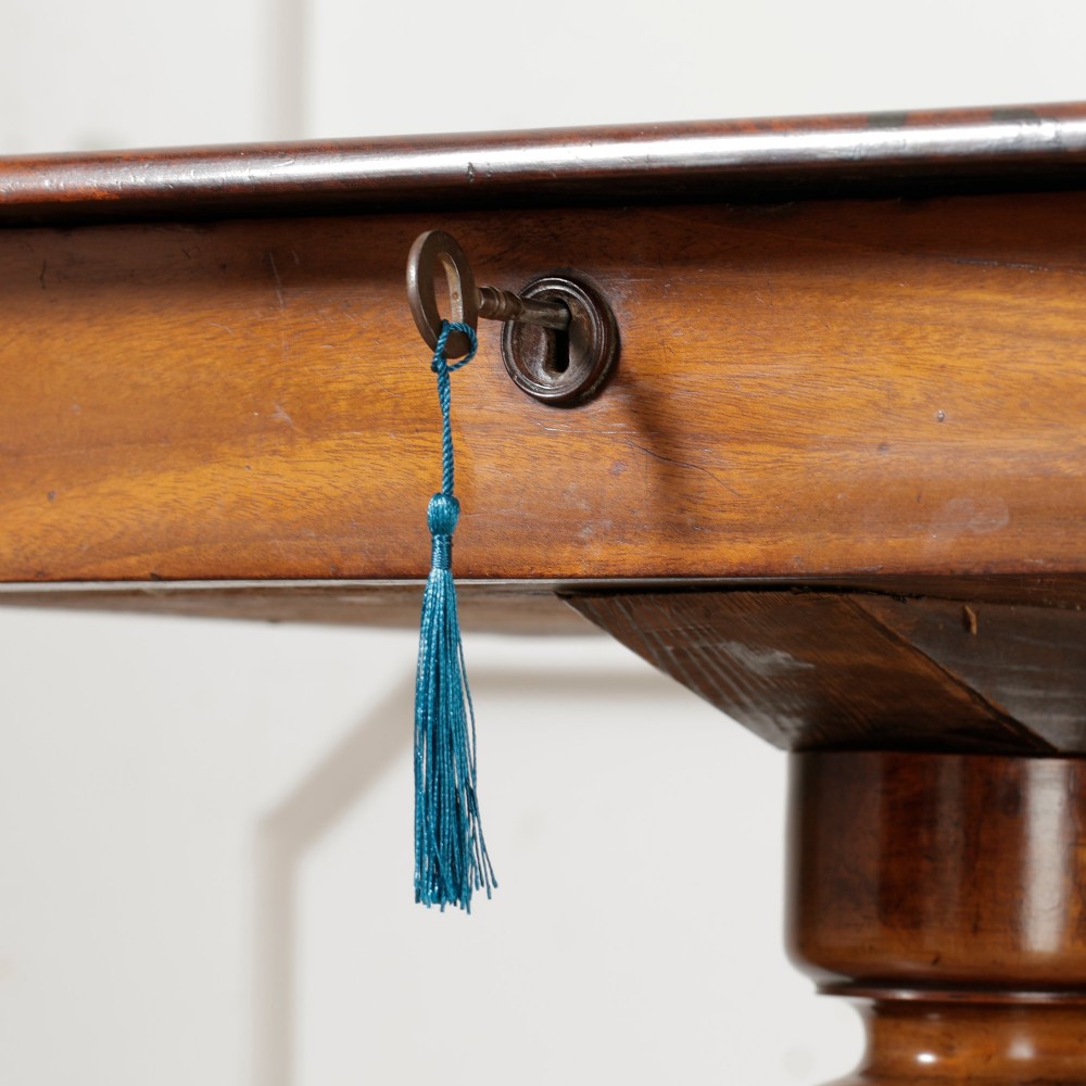 A Victorian mahogany pedestal table featuring a square top with a drawer, a central bobbin-turned stem, and a carved tripod base. View VIII