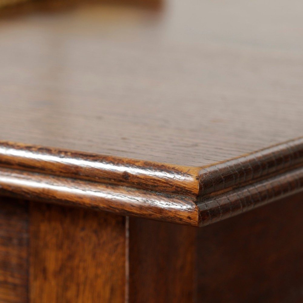 A George III Georgian oak side table featuring a single drawer with a brass handle plate and four square tapered legs. View VII